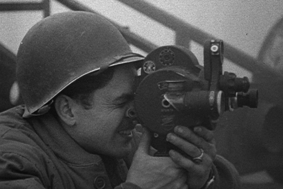 A soldier with a camera in Five Came Back (2017)
